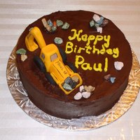 Excavator Cake chocolate fudge cake covered with chocolate buttercream icing.Made for a friend who loves his excavator