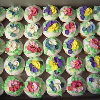 Bridal Shower Cupcakes For a bridal shower with a "garden" theme; royal icing flowers with buttercream leaves