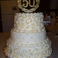 50Th Yellow cake with cream cheese icing. Six, eight and ten inch tiers.