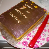 Spell Book Cake Book is cake with fondant decorations & gumpaste cover. Wand is rice krispies with fondant.