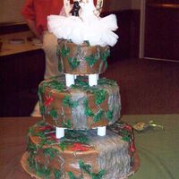 Camo THIS IS MY FIRST CAMO AND WEDDING CAKE EVER. THE SMALL CAKE IS THE SAMPLE I DID FOR THE BRIDE. IT IS ALL DONE IN BC ICING.