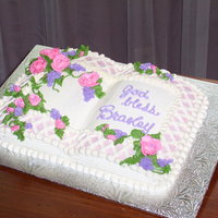 Christening Cake book shaped cake decorated with buttercream icing and flowers for baby christening