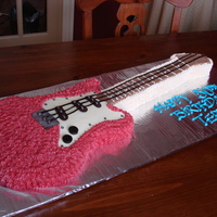 Guitar Cake Birthday cake made with 2 9 x 13 cake and cut into shape of guitar - iced and details made using some candies and gum paste and licorise...