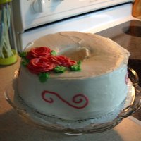 Angelfood iced angel food cake, red roses
