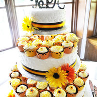 Sunflower Wedding - Cupcake/cake Tower Made for a friend who wanted cupcakes for easy serving but also wanted a "brides cake" to save for 1st anniversary. The groom...