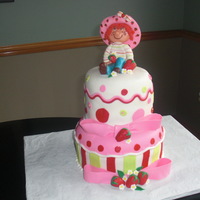 Strawberry Shortcake The doll is made completely out of white chocolate. Was given a picture from the client to match.