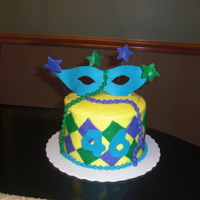 Mardi Gras The blue is molding chocolate. Fondant accents. Chocolate Chiffon cake w/chocolate cream filling.