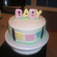 Baby Shower Clothes Line The top is cookies w/fondant. Clothes line all around. buttercream icing w/fondant accents