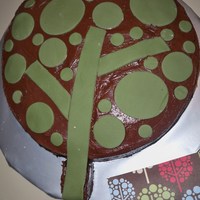 Tree Cake this cake my sil wanted it to match the tree on the paper so i threw it together last minute its chocolate bc with fondant circles