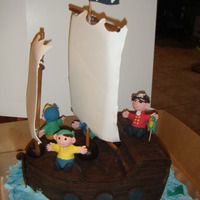 Pirate Ship 3D pirate ship for little boys birthday party. Sheet cake stacked and carved for the ship. Covered with chocolate fondant that was rolled...