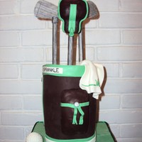 Golf Bag 3 6", covered in modeling chocolate, clubs are gumpaste, ball is RK covered in fondant.....thank you to all the past CC's for...