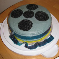 Movie Reel This was one of two cakes that I made for a colleague who left to pen a screenplay for a major Hollywood motion picture. I only had a few...