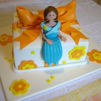 Bow And Figurine Cake This is a cake that I made at a Planet Cake course in Brisbane, Queensland, Australia recently.Dark chocolate mudcake, torted and coated in...