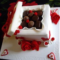 Chocolate Box Cake White chocolate & Baileys liqueur mudcake, coated in white chocolate ganache and covered in fondant. Lid is styrofoam covered in...