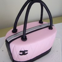 Chanel Handbag Cake Dark chocolate mudcake, torted and coated in dark chocolate ganache and covered in fondant. Taken from the Planet Cake book.