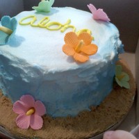 Aloha!!! One of my nieces teachers ordered this cakes. Hawiian themed fondant flowers and buttercream air brushed blue.
