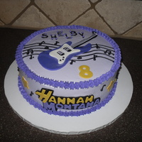 Hannah Montana Cake Strawberry cake with buttercream icing and fondant accents.