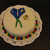 Calla Lily And A Bumble Bee This is my first time ever decorating a cake with fondant (not a class). This is a chocolate cake with orange flavored whipped BC. I would...