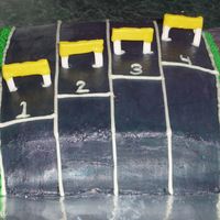 Track And Field Cake Cake is BC hurdles are fondant and gumpast lines and numbers are royal icing