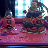 Gum Ball Machine Sweet Treat Cake Done for my 2 yr old niece wanted a gumball machine cake and mom wanted sweet treat cake so I compromised and made both. Really fun cakes...