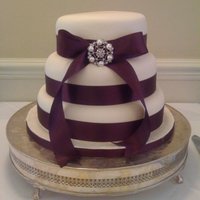 Wedding Cake Three tier sponge cake covered in fondant and marzipan.I had problems levelling the cake when i got to venue but i think ive got away with...