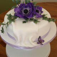 Anemone Cake Vanilla sponge with sugar anemone flower, ruscus and ivy topper.