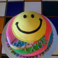 Smiley Face 9" chocolate with chocolate filling. Half Sport Ball rainbow cake for smiley face all covered in fondant. I was so worried about...