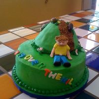 Over The Hill Cake is vanilla with strawberry filling and IMBC with fondant accent. Hill is fondant covered RKT with cookie crumb dirt and hard candy...