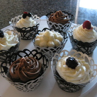 Cupcakes And Co. Just some practice cupcakes for decorative purposes. Chocolate cake with Chocolate and Vanilla Buttercream. Some are garnished with...