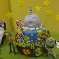 Toy Story 3 Cake I found a few pictures of this cake design online and duplicated it on my own. This was my first attempt at a fondant, tiered cake made for...