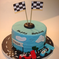 Race Car Cake 8 round WASC with MMF fondant. MAde for my sons 9th birthday, Needed to put more buttercream underneath as you can see the layers......