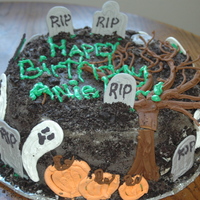 Graveyard Nightmare Made all the gravestones, ghost, pumpkins, bats and tree out of royal icing.buttercream cake