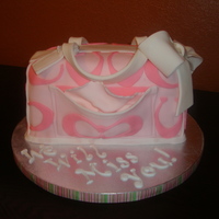 Tiffany's Coach Purse This was my first attempt at a purse cake. It was made for a friend from church that is moving out of state. The cake is yellow with...