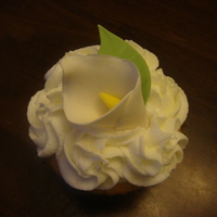 Wedding Calla Lily Cupcakes Jumbo golden vanilla cupcakes with buttercreme frosting and a gumpaste calla lily. These were placed in individual boxes and handed out to...