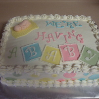 Jo-Ann's Surprise Golden vanilla cake with vanilla coolwhip w/pineapple filling and buttercream icing w/fondant baby accents