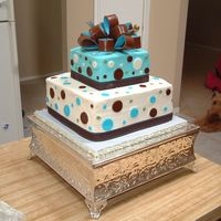 Brown And Blue Baby Shower Cake Butter cream icing with MMF circles and regular Fondant bow. Brown ribbon.