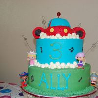 Little Einsteins Made this for my daughter's 3rd birthday. Rocket made from small oval pan and small 1/2 ball pan. boosters made from ice cream cones....