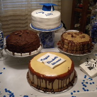 Graduation Cakes The honoree wanted one cake and both of her parents wanted a different one. We compromised. German Chocolate, Peanut Butter, Chocolate cake...