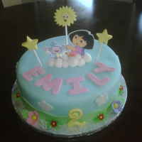 Dora In The Clouds chocolate cake with buttercream filling. Fondant icing and fondant accents with gumpaste details.