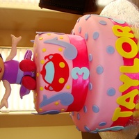 Einsteins Fondant icing and accents. Top tier is chocolate bottom tier is vanilla.