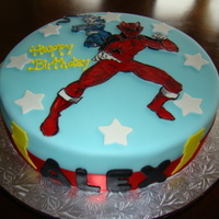 Power Rangers Chocolate with buttercream filling. Fondant icing with painted freehand drawing