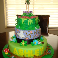 Tinkerbell three tier tinkerbell cake. Vanilla cake with buttercream filling. Fondant icing with fondant accents.