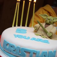 Star Wars Master Yoda Cake This is my firt cake using fondant ever - but I had a blast doing it. Got the fondant readymade off the internet and loved working with it...