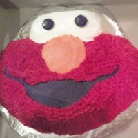 Elmo This cake was made using the Wilton Elmo cake pan. It was for a little girls birthday party. I always have a hard time making buttercream...