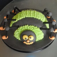 Halloween Spider Chocolate Sponge with chocolate frosting covered with black fondant icing, green buttercream piping detail and liquorice legs.