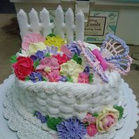 First Royal Frosting Cake My first time using Royal frosting and I made all kinds of flowers and butterflies just in time for Mothers Day.