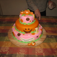 Pumpkin Theme First Birthday Cake This is a three tiered birthday cake that I made for my daughter's first birthday. The top tier is sour cream pound cake, the middle...