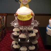 8Th Grade Graduation Cake 8th grade cupcake graduation cake and cupcakes. Cake is buttercream and fondant. Cupcake wrapper made out of chocolate hardened in Wilton...