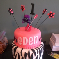 First Birthday Cake - Girls Rock Theme Girls Rock baby girl first birthday cake. Buttercream and fondant. Everything but guitar is edible. Name cut on Cricut