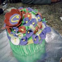 Flower Bundle Layer of strawberry and chocolate cake with fondant flowers stems and ribbon